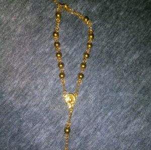 Gold colored rosary bracelet